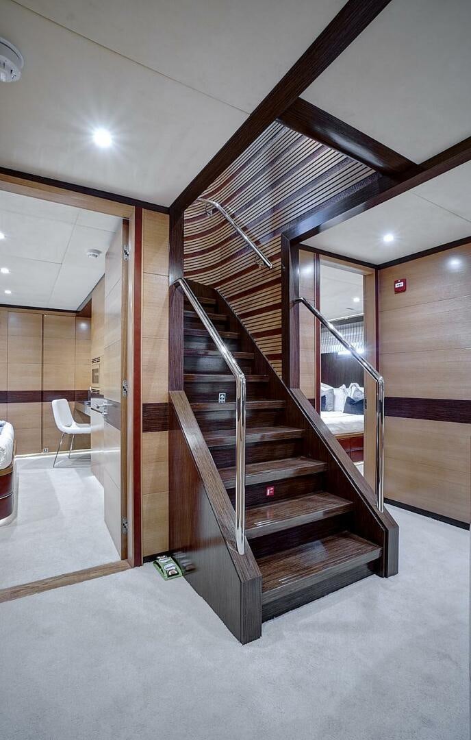 a wooden staircase in a building aboard SWEET CAROLINE Yacht for Sale