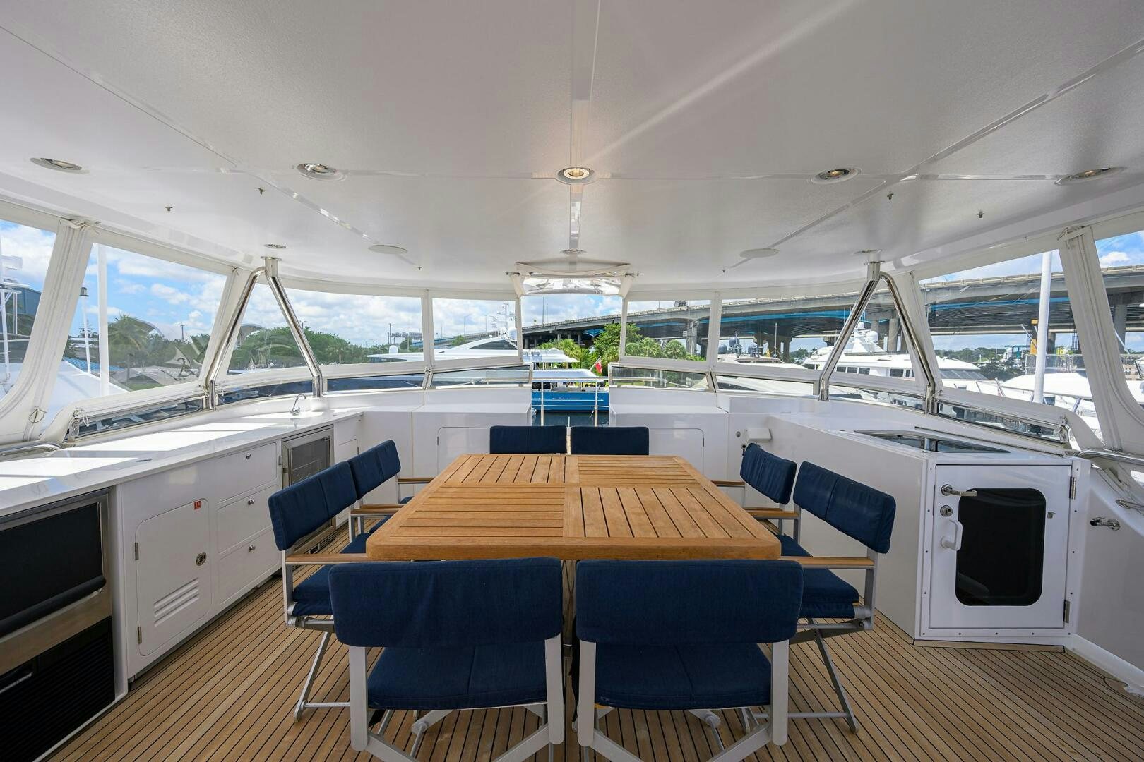 inside of a building with a table and chairs aboard SOLACE Yacht for Sale