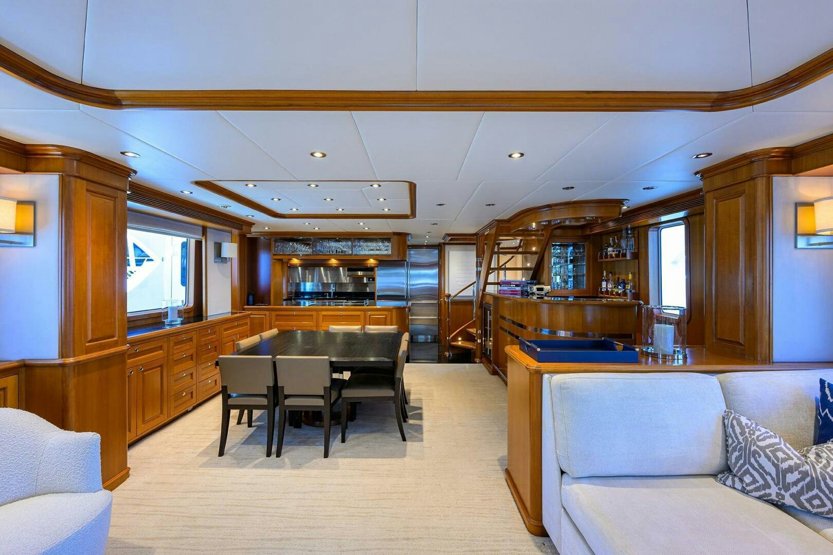 a living room with a couch and a table aboard SOLACE Yacht for Sale