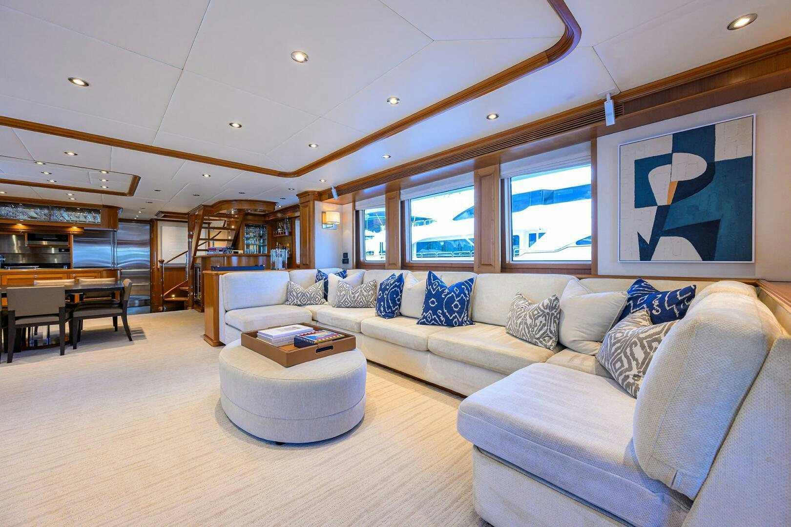a living room with a couch and a table aboard SOLACE Yacht for Sale