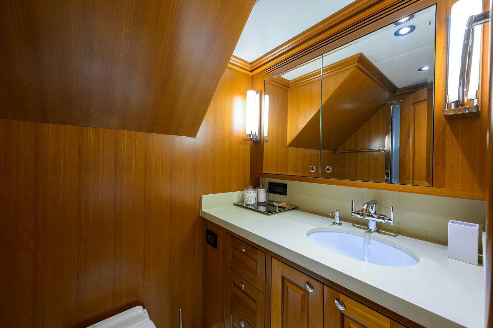 a bathroom with a sink and a mirror aboard SOLACE Yacht for Sale