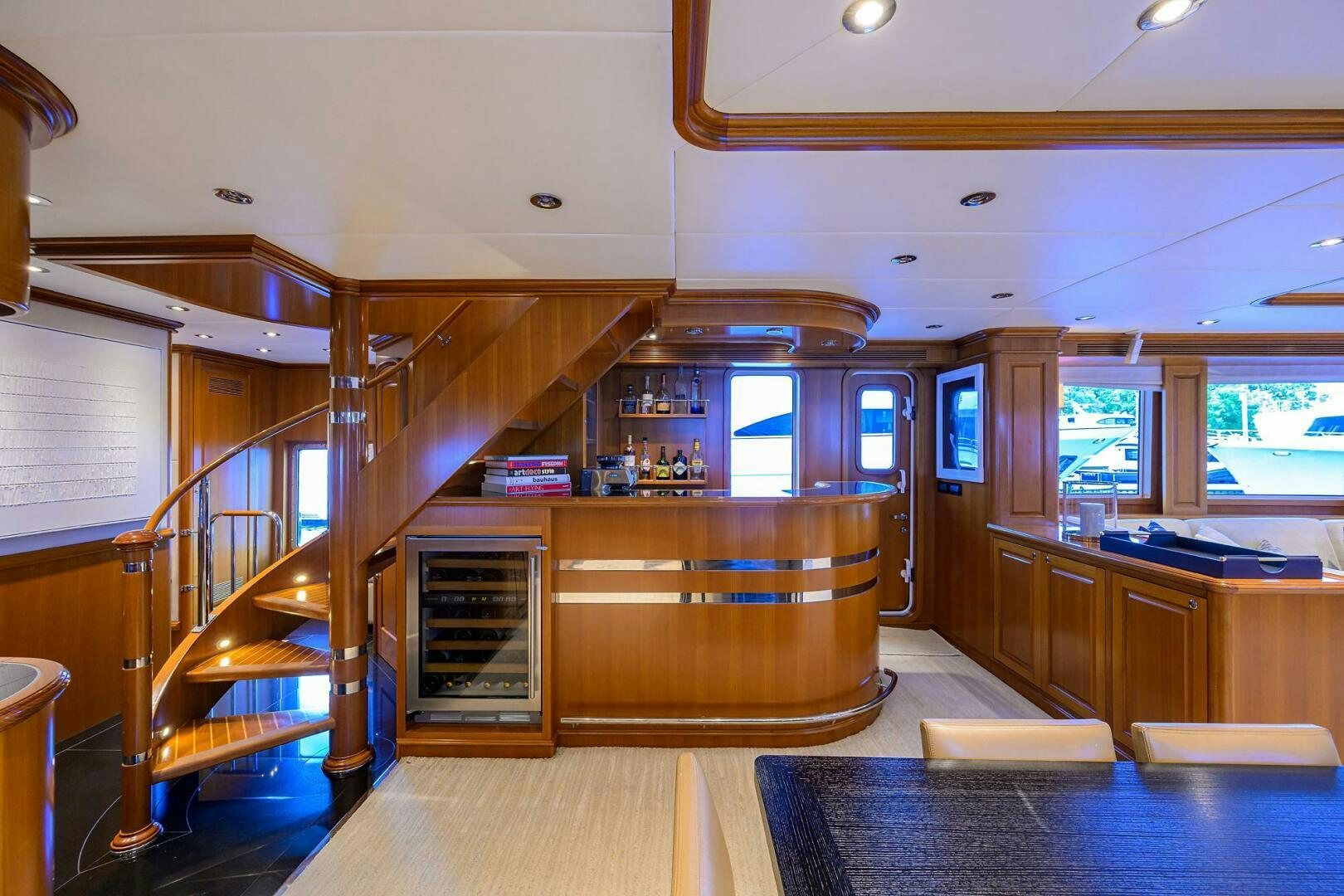 a room with a wood staircase and a glass door aboard SOLACE Yacht for Sale