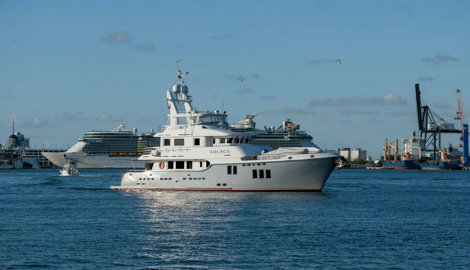 a white boat in the water aboard SOLACE Yacht for Sale