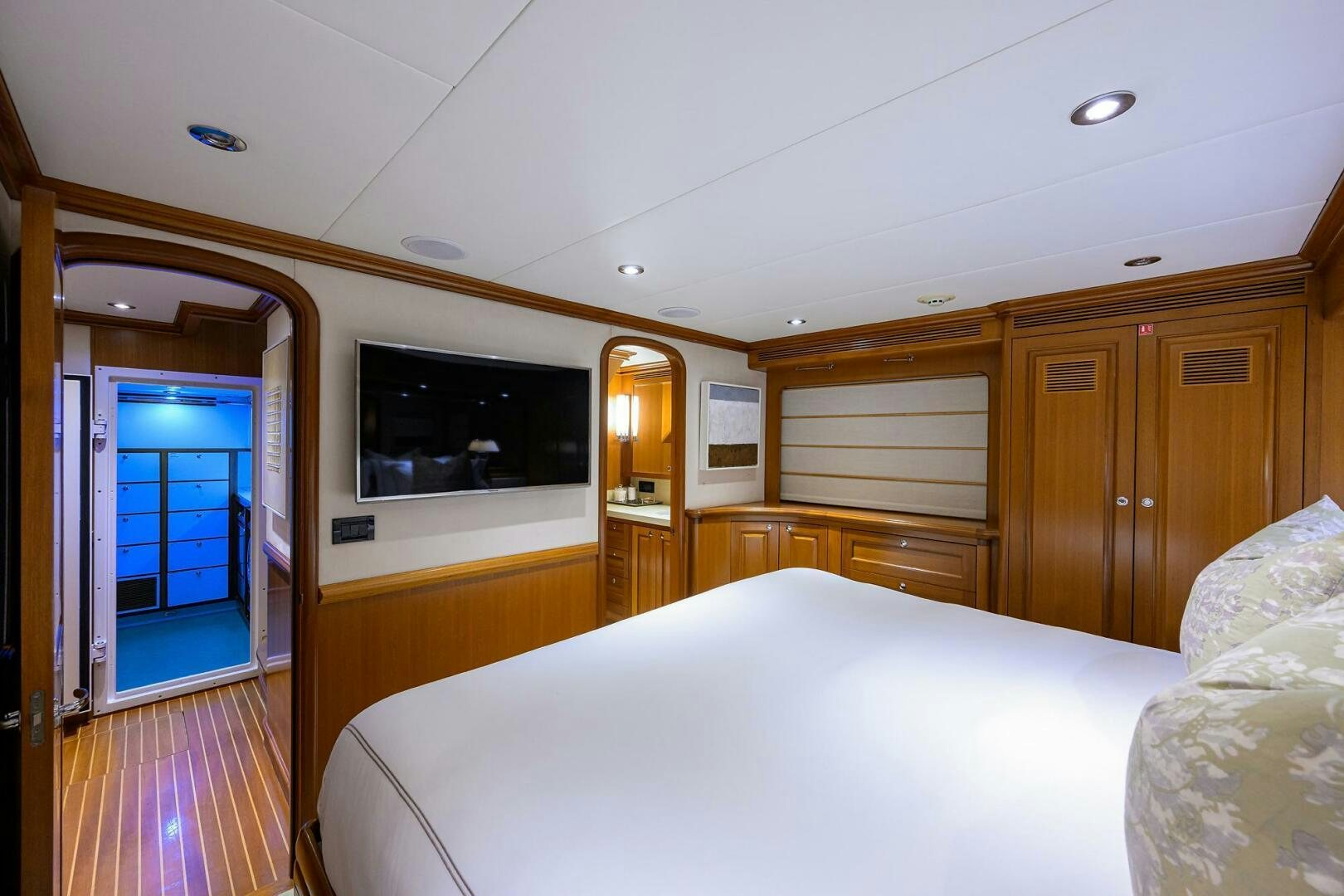 a hotel room with a bed and tv aboard SOLACE Yacht for Sale