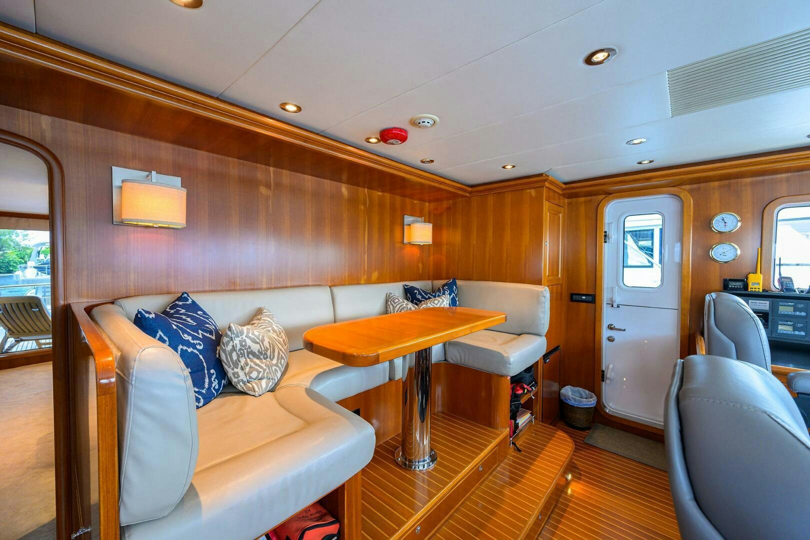 a living room with a couch and a table aboard SOLACE Yacht for Sale