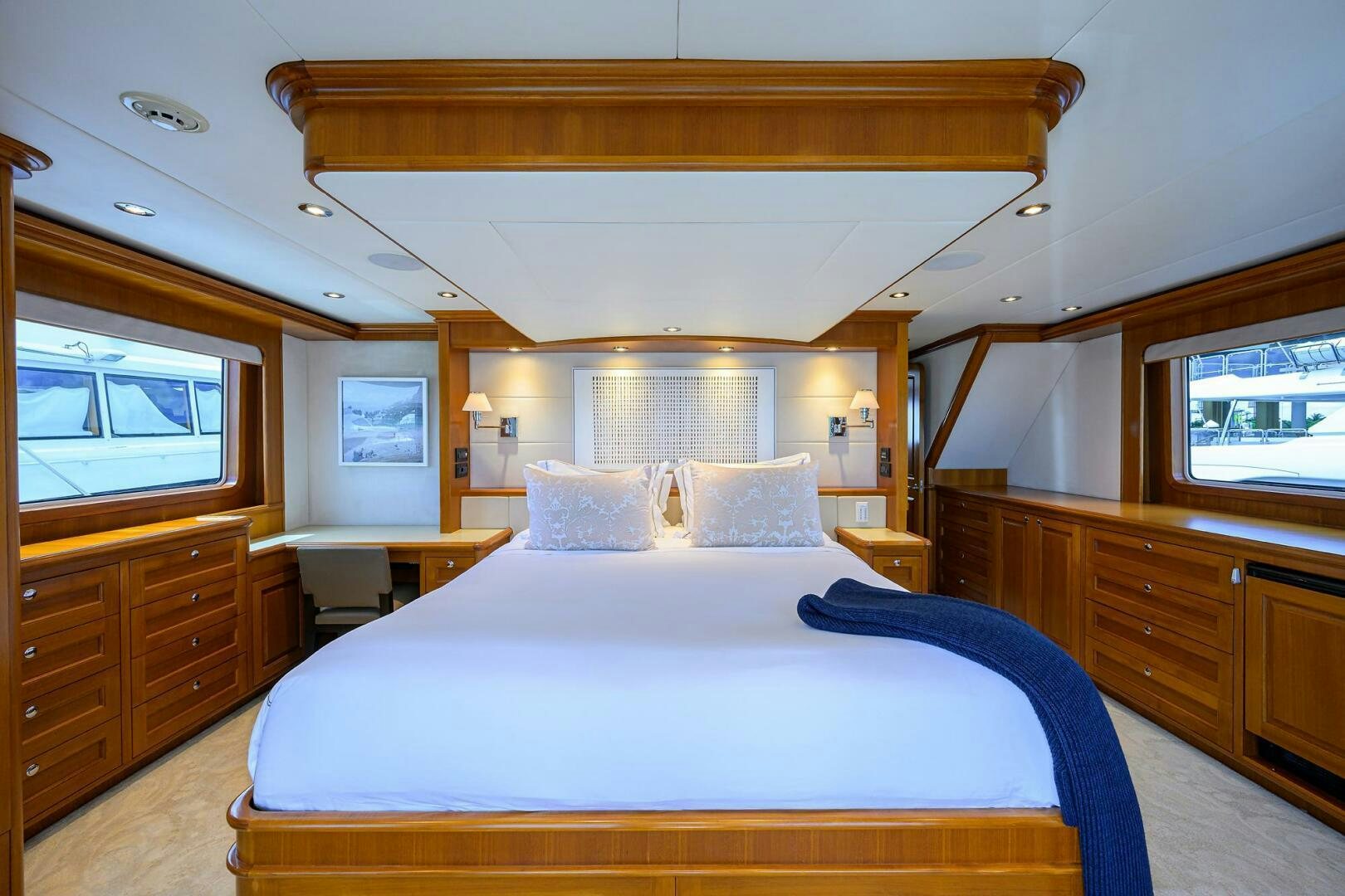 a bedroom with two beds aboard SOLACE Yacht for Sale