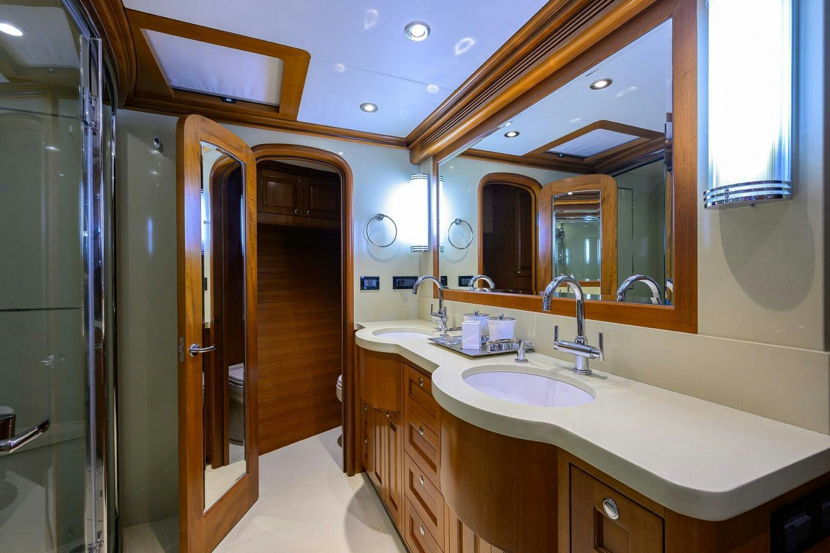 a bathroom with a large mirror aboard SOLACE Yacht for Sale