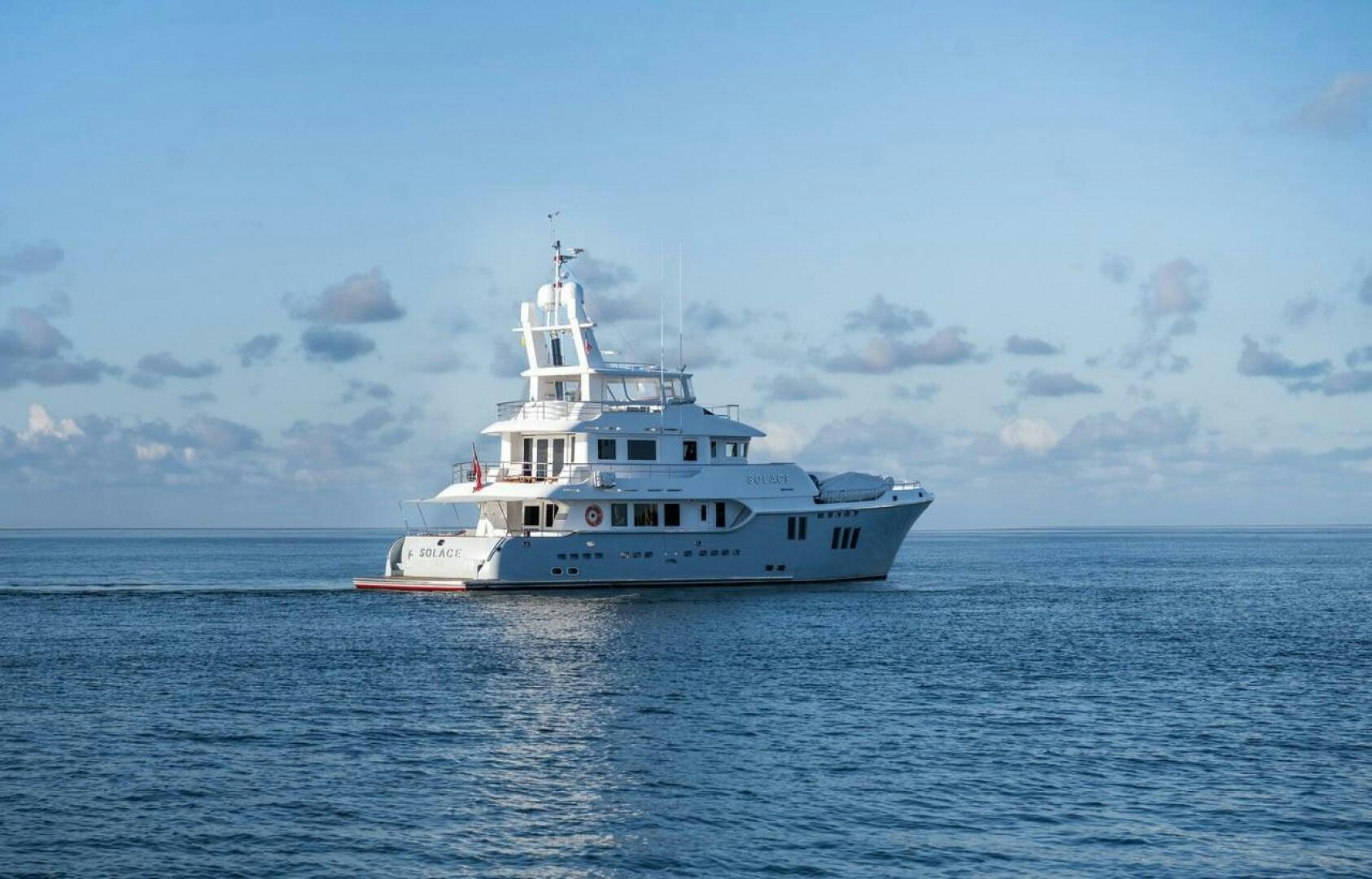 a white boat in the water aboard SOLACE Yacht for Sale