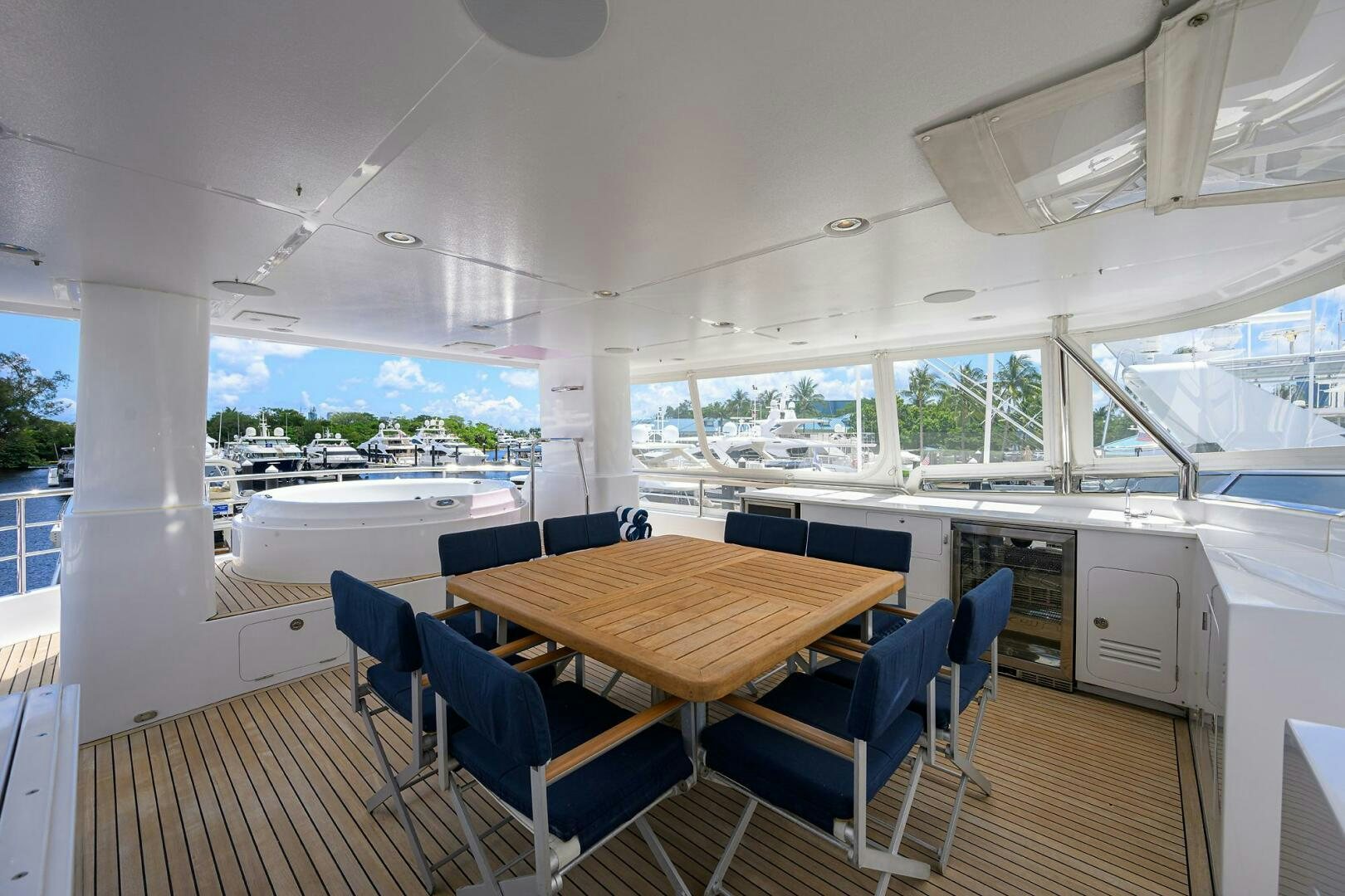 a table and chairs in a room aboard SOLACE Yacht for Sale