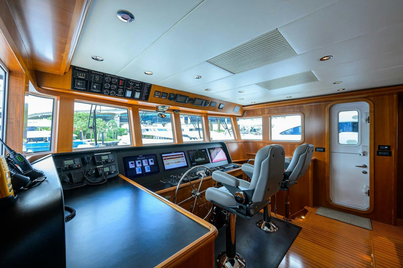 a room with a table and chairs aboard SOLACE Yacht for Sale