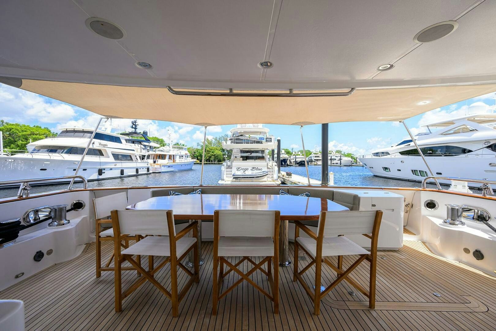 a table and chairs on a deck aboard SOLACE Yacht for Sale