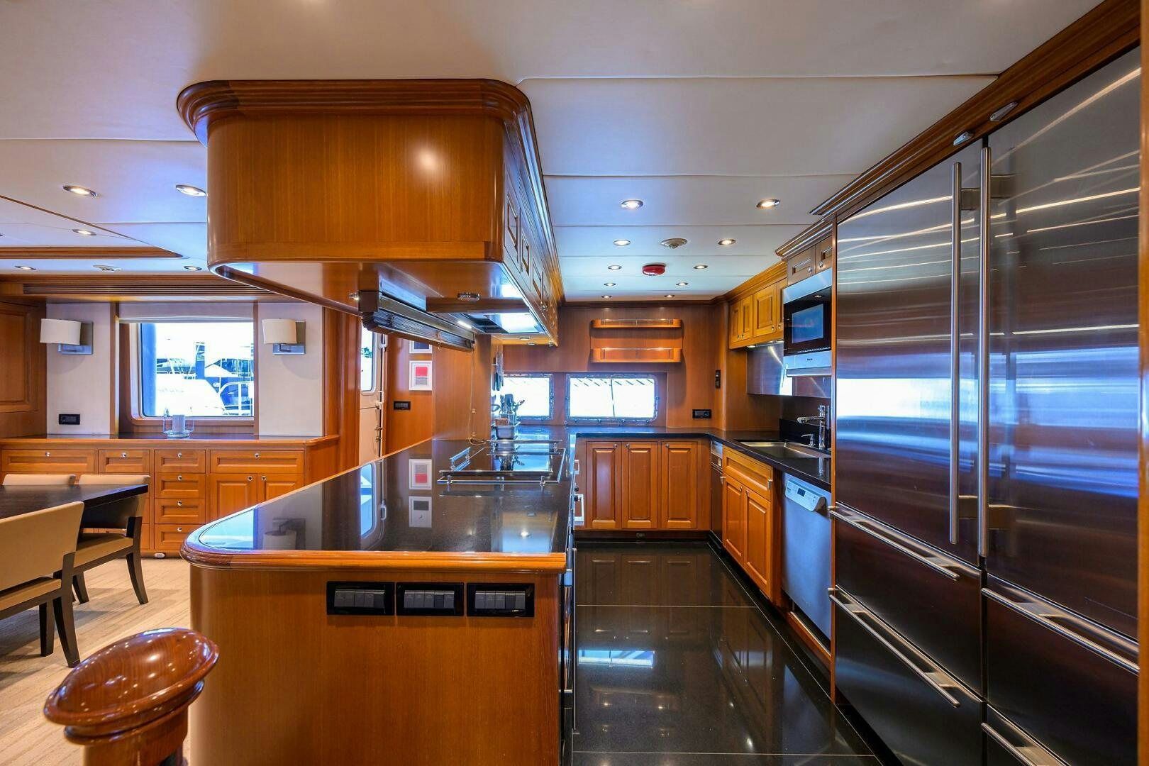 a kitchen with stainless steel appliances aboard SOLACE Yacht for Sale
