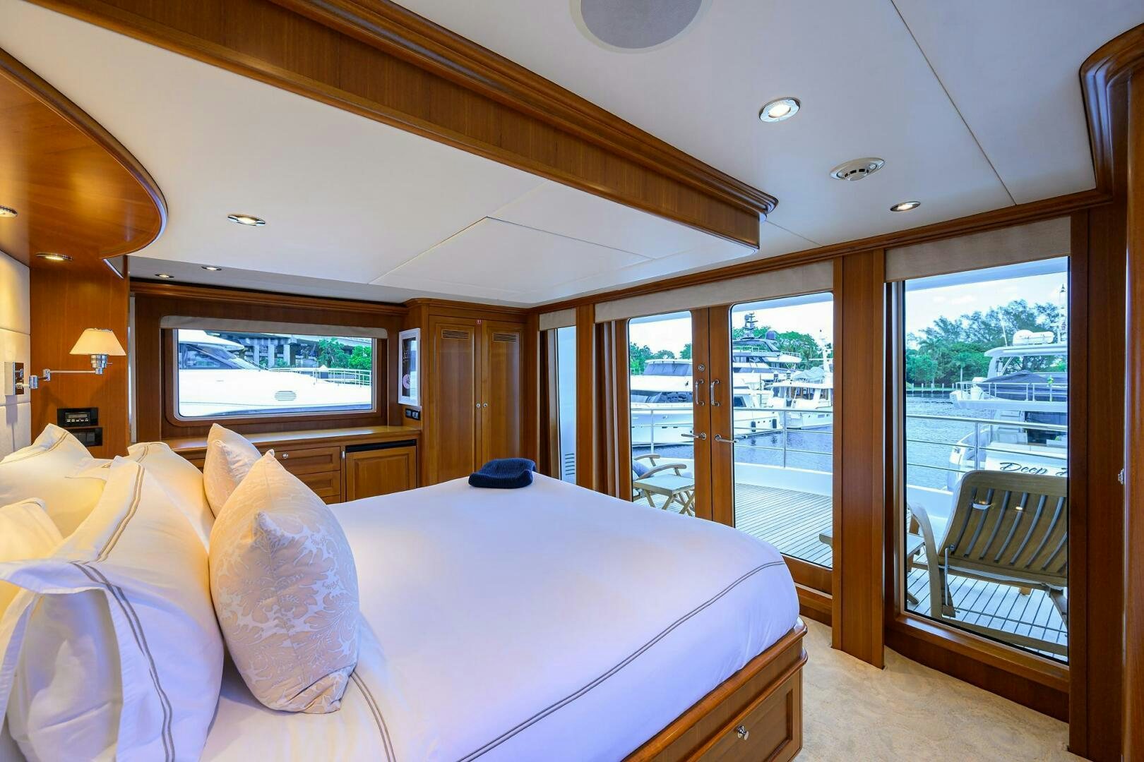 a large bed in a room aboard SOLACE Yacht for Sale
