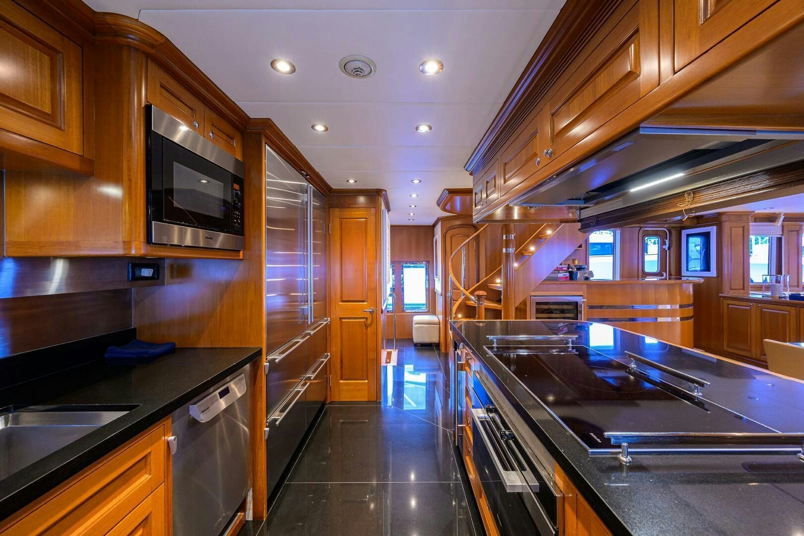 a kitchen with a large island aboard SOLACE Yacht for Sale