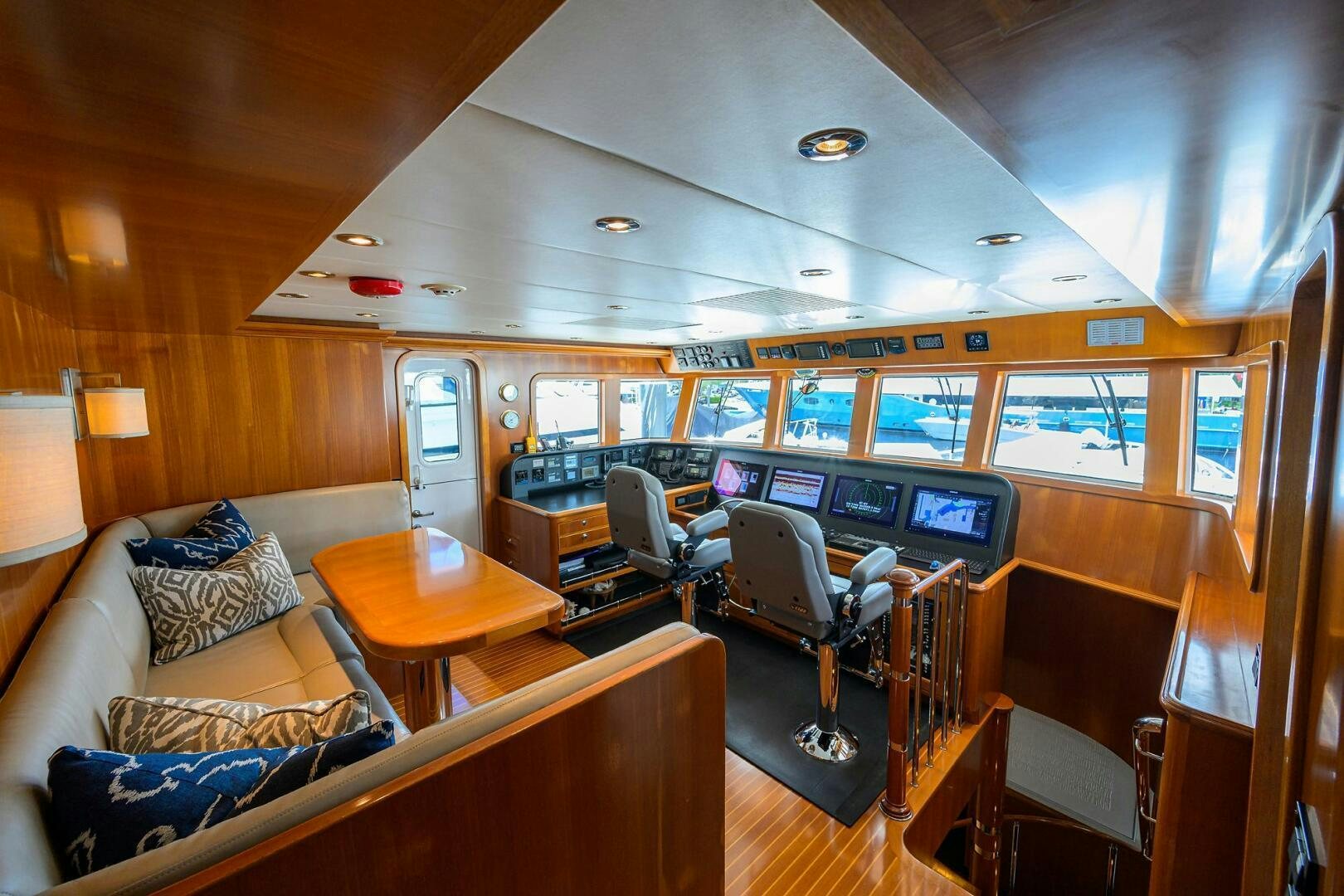 a living room with a large screen aboard SOLACE Yacht for Sale