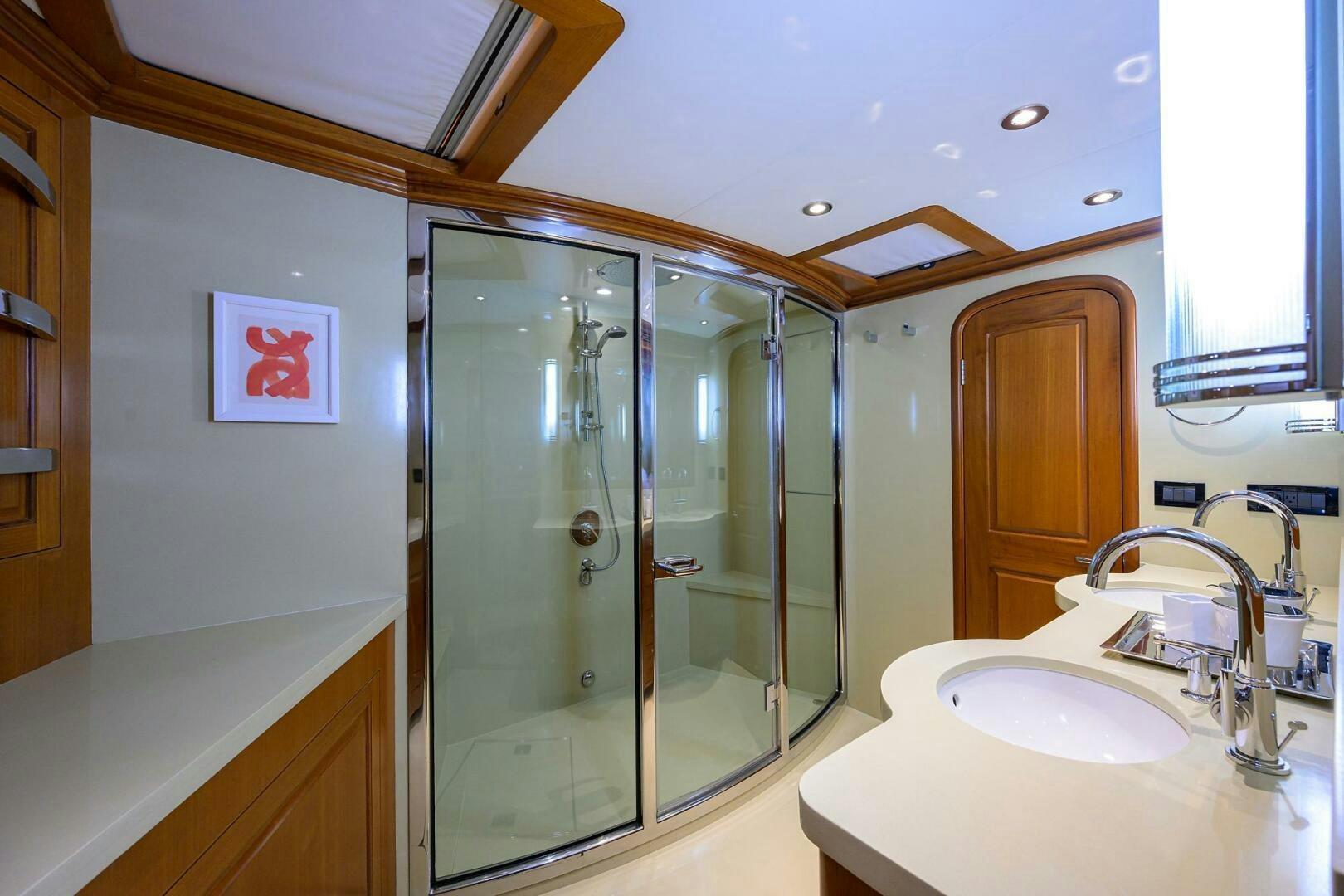 a bathroom with a glass shower aboard SOLACE Yacht for Sale