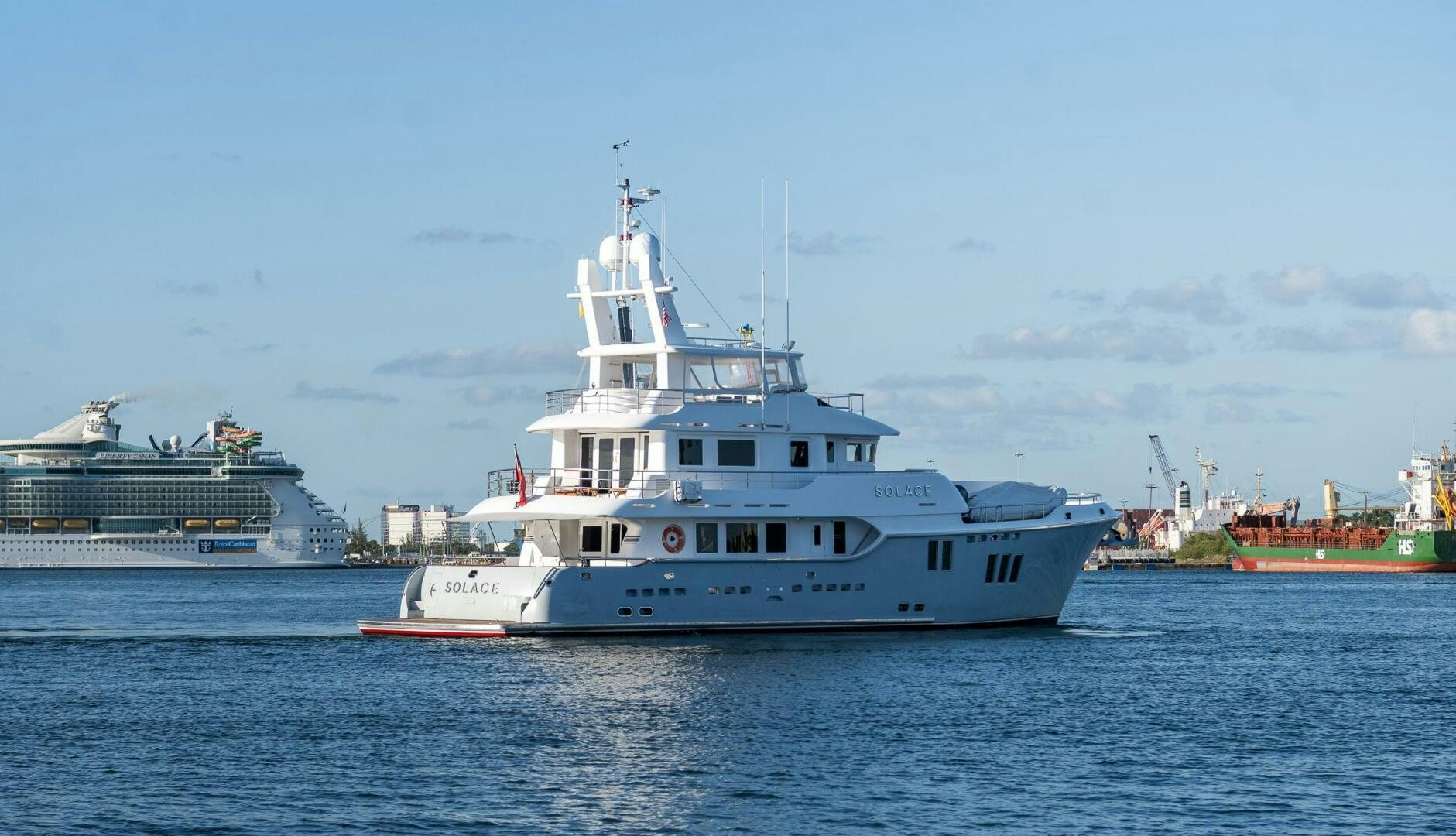a large white boat in the water aboard SOLACE Yacht for Sale