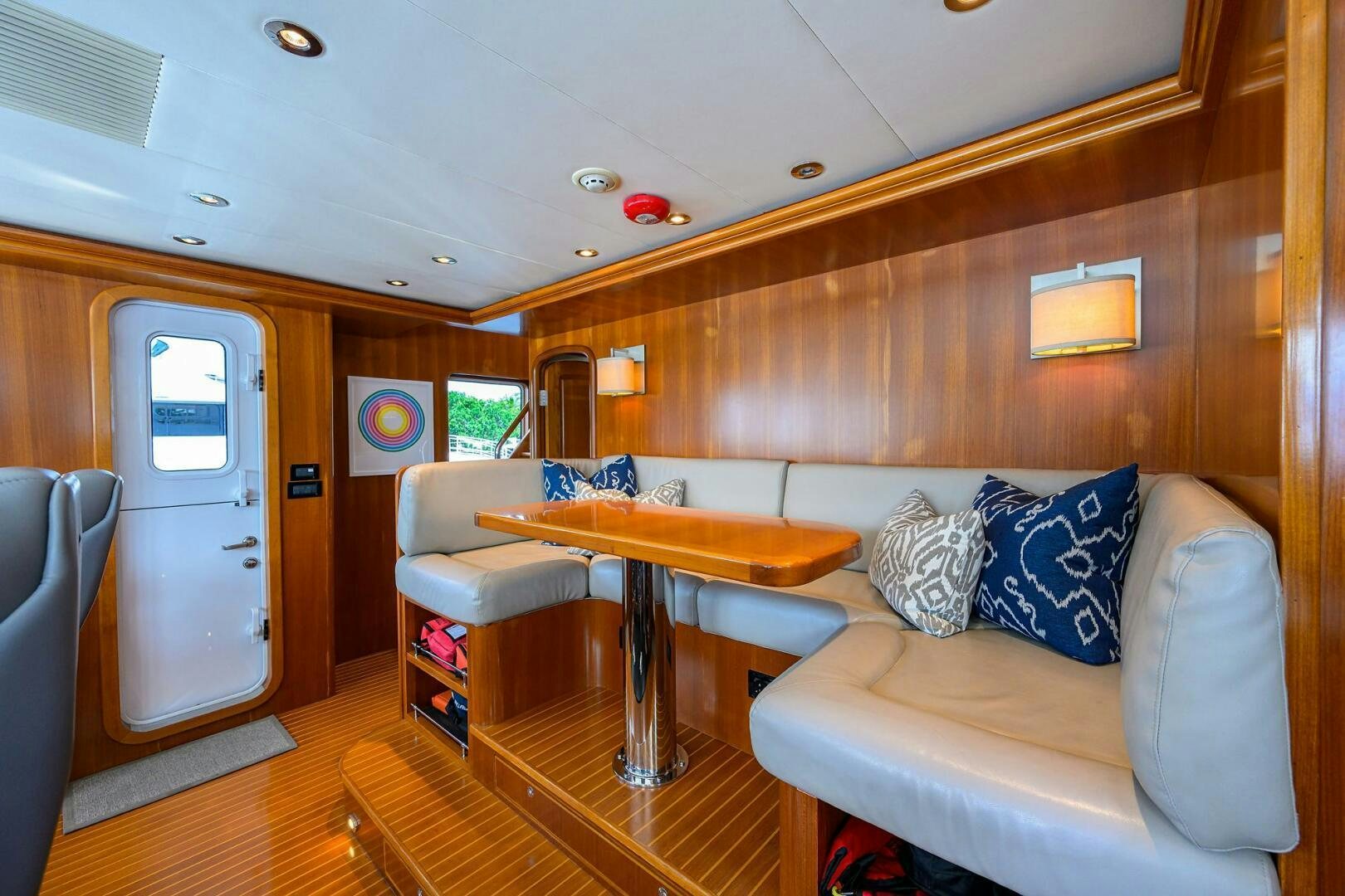a living room with a couch and a table aboard SOLACE Yacht for Sale
