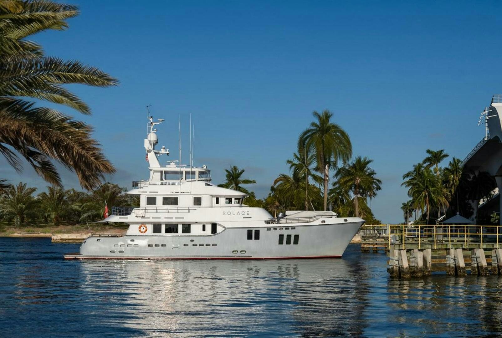 a white boat in the water aboard SOLACE Yacht for Sale
