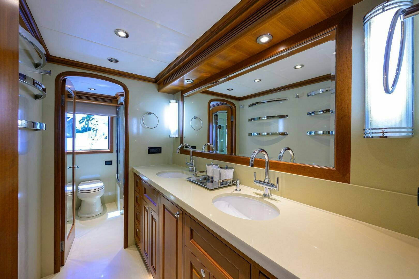 a bathroom with a large mirror aboard SOLACE Yacht for Sale