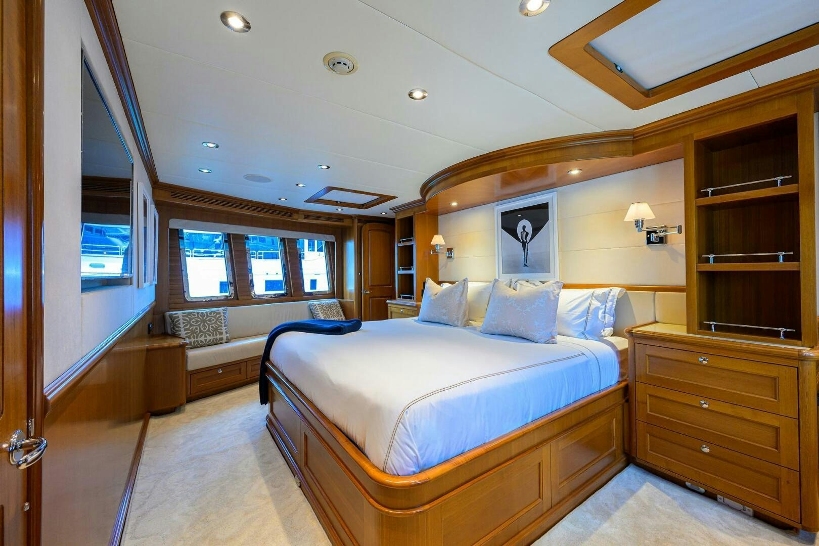 a bedroom with a bed and a window aboard SOLACE Yacht for Sale