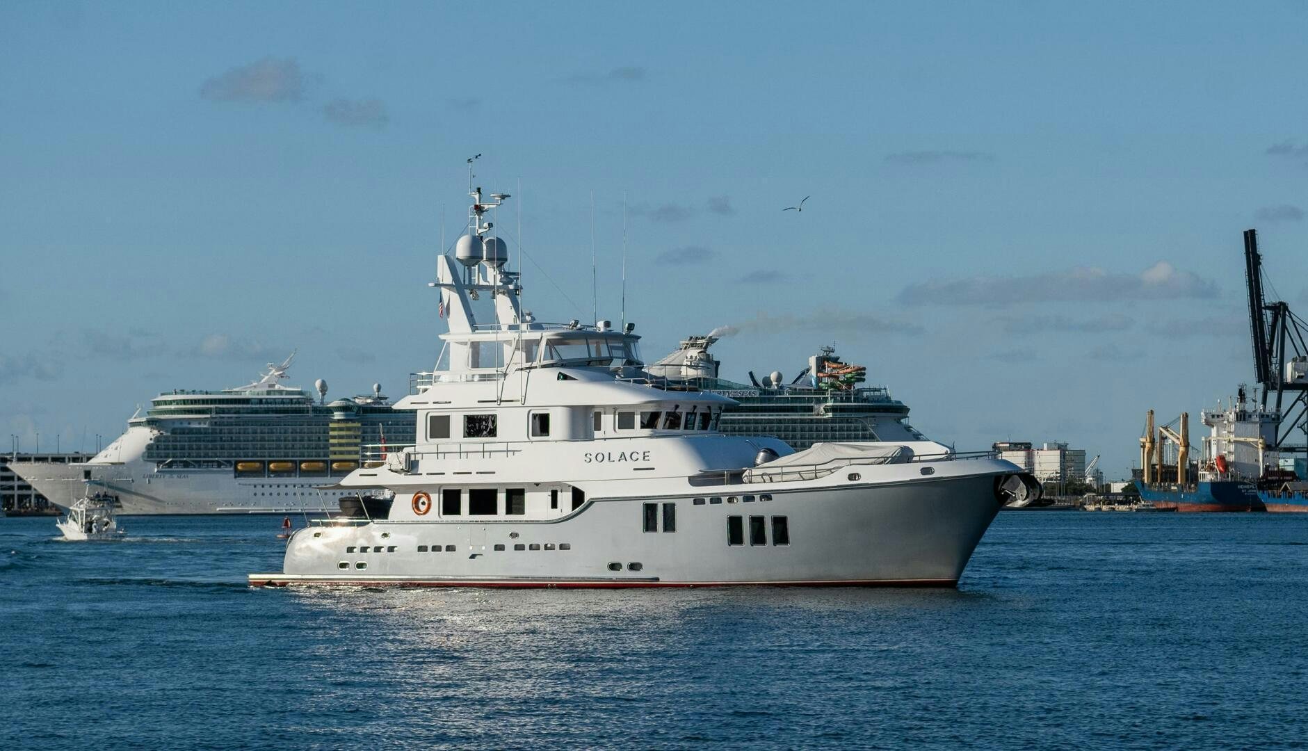 a large white boat in the water aboard SOLACE Yacht for Sale