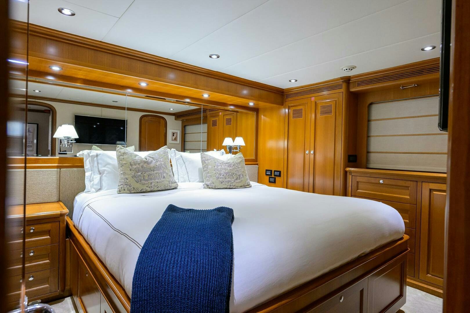 a bedroom with a large bed aboard SOLACE Yacht for Sale