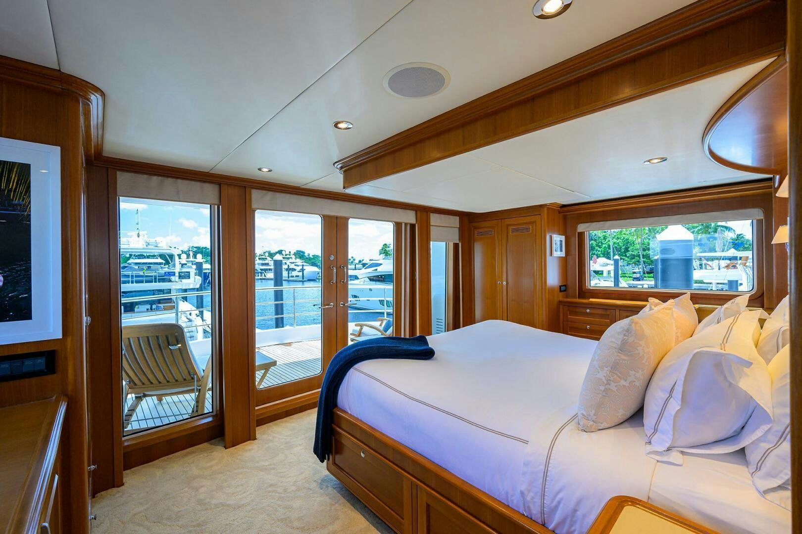a bedroom with a large bed aboard SOLACE Yacht for Sale