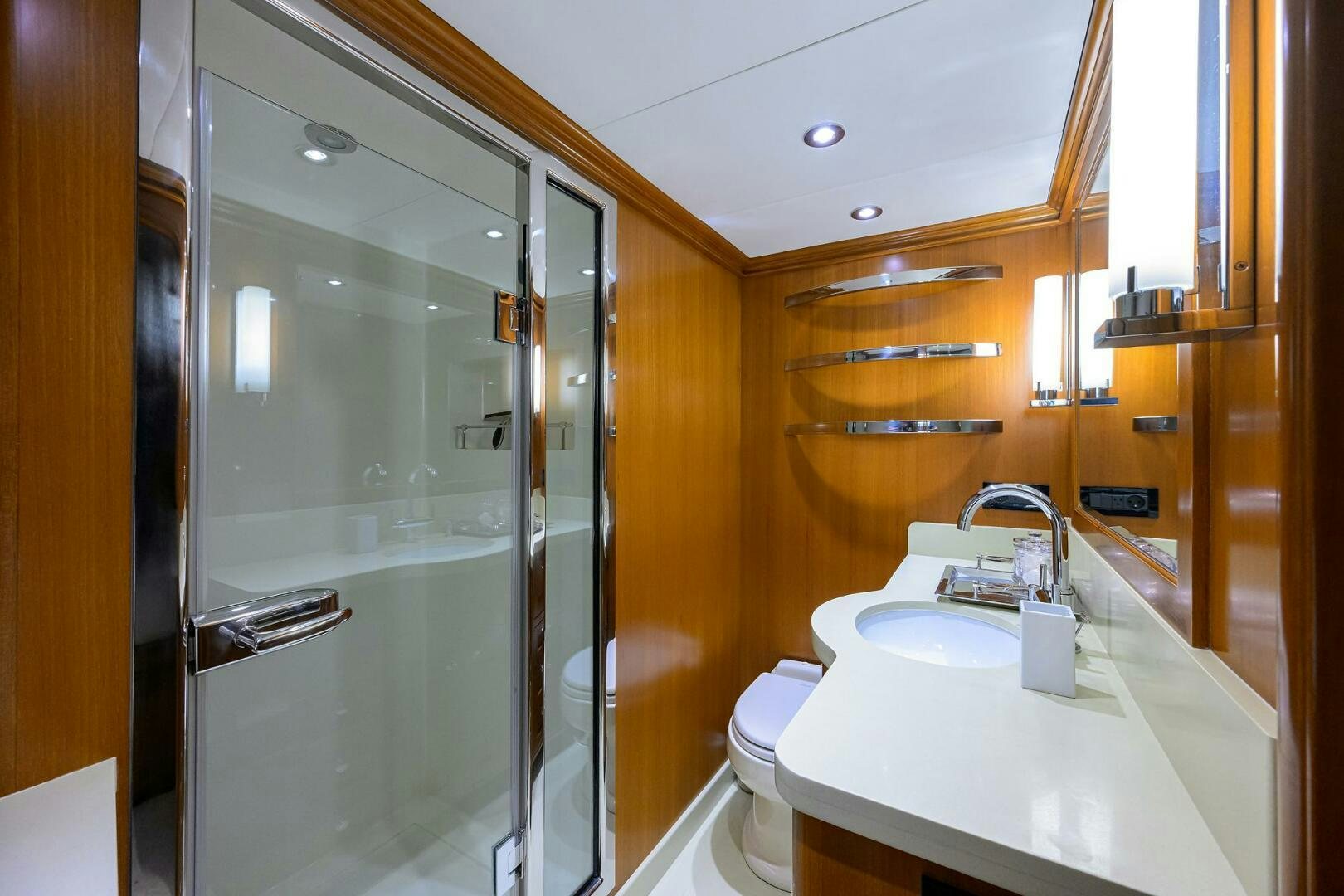 a bathroom with a glass shower aboard SOLACE Yacht for Sale