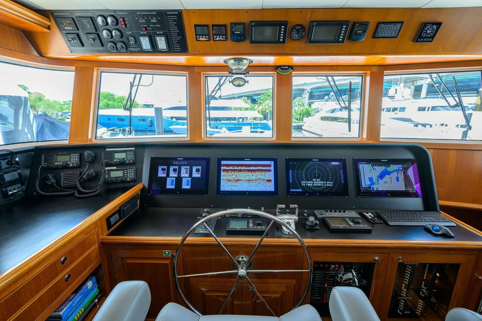 a room with computers and monitors aboard SOLACE Yacht for Sale