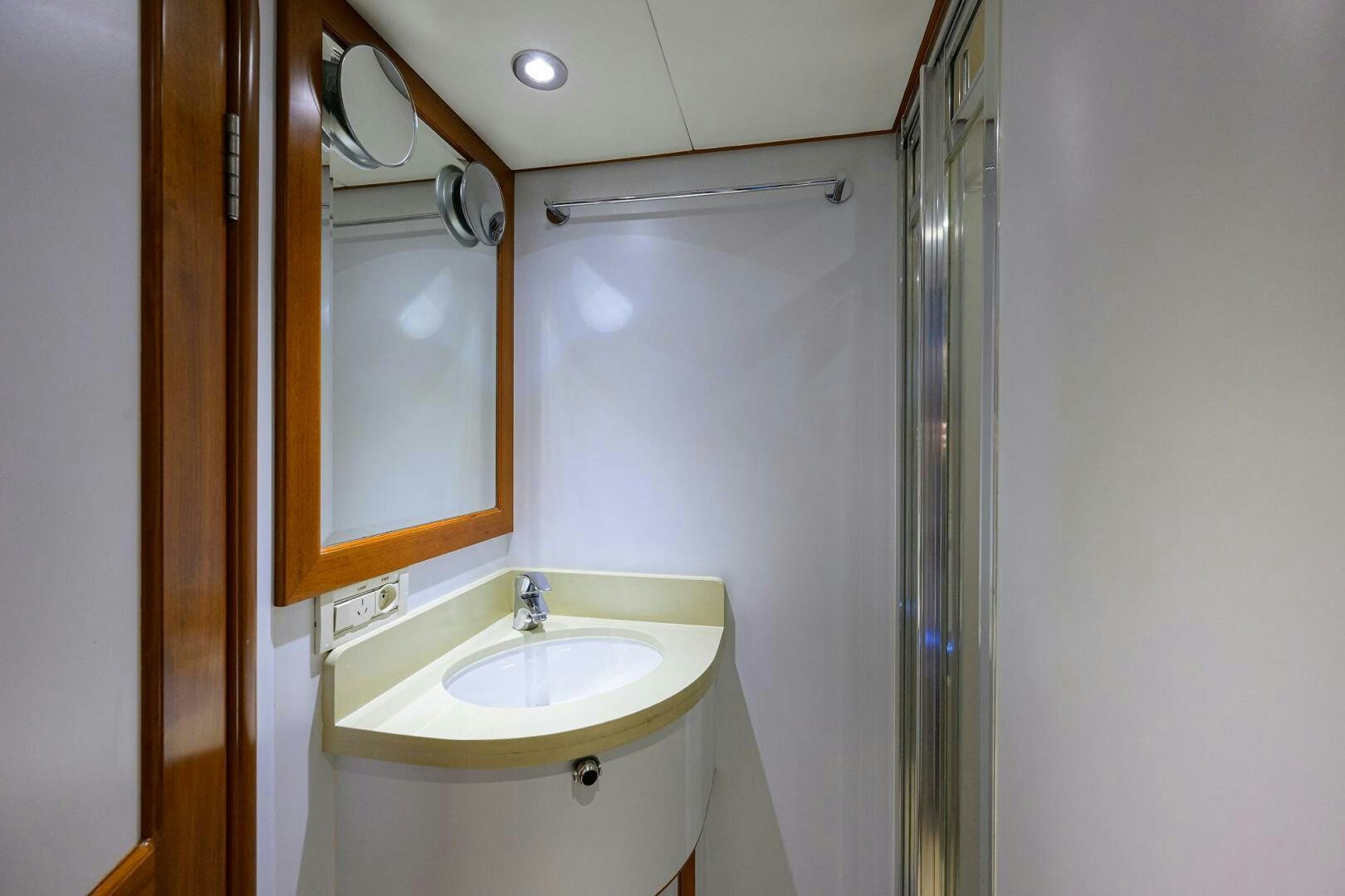 a bathroom with a sink and a mirror aboard SOLACE Yacht for Sale