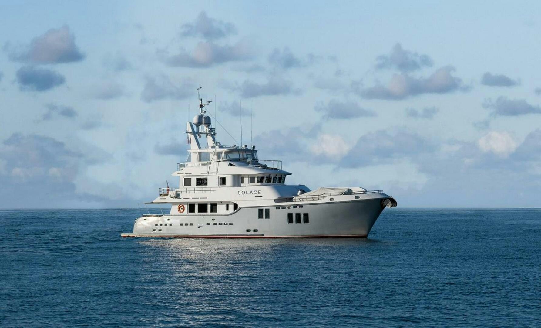 a large white boat in the water aboard SOLACE Yacht for Sale