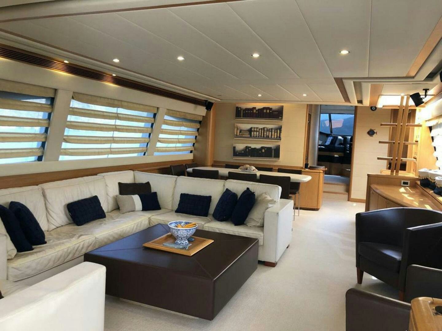 a living room with a couch and a coffee table aboard MAR AZUL Yacht for Sale