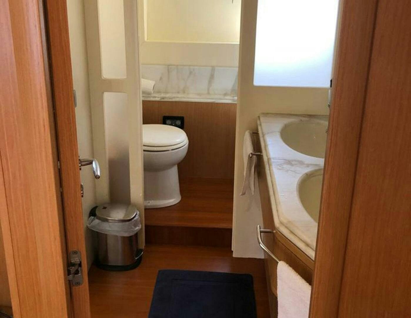 a bathroom with a sink toilet and tub aboard MAR AZUL Yacht for Sale