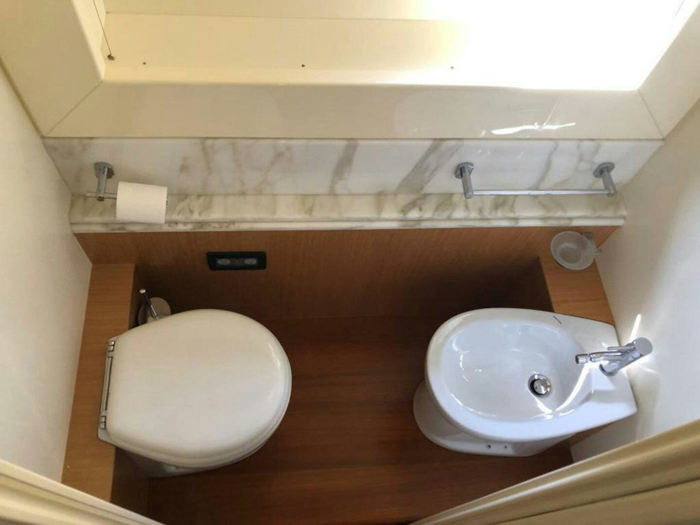 a bathroom with a sink and toilet aboard MAR AZUL Yacht for Sale