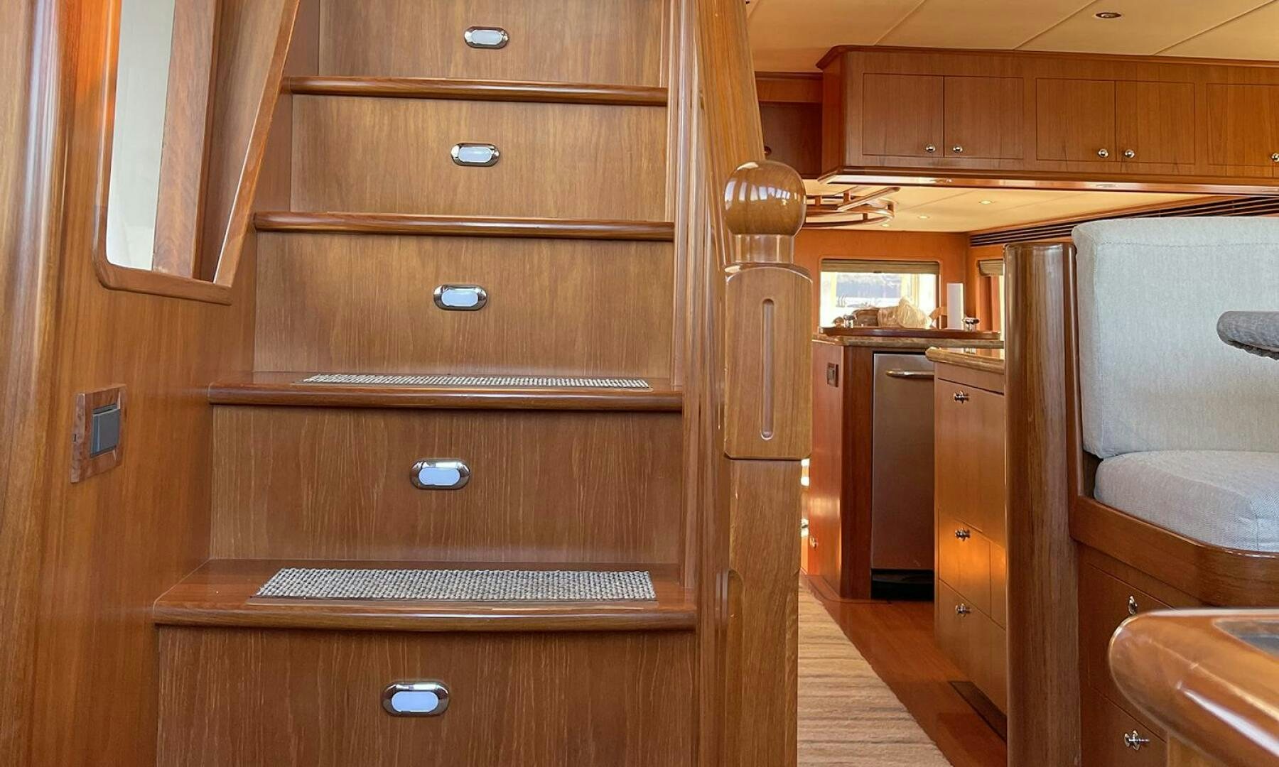 a wooden cabinet with drawers aboard BRAVO! Yacht for Sale