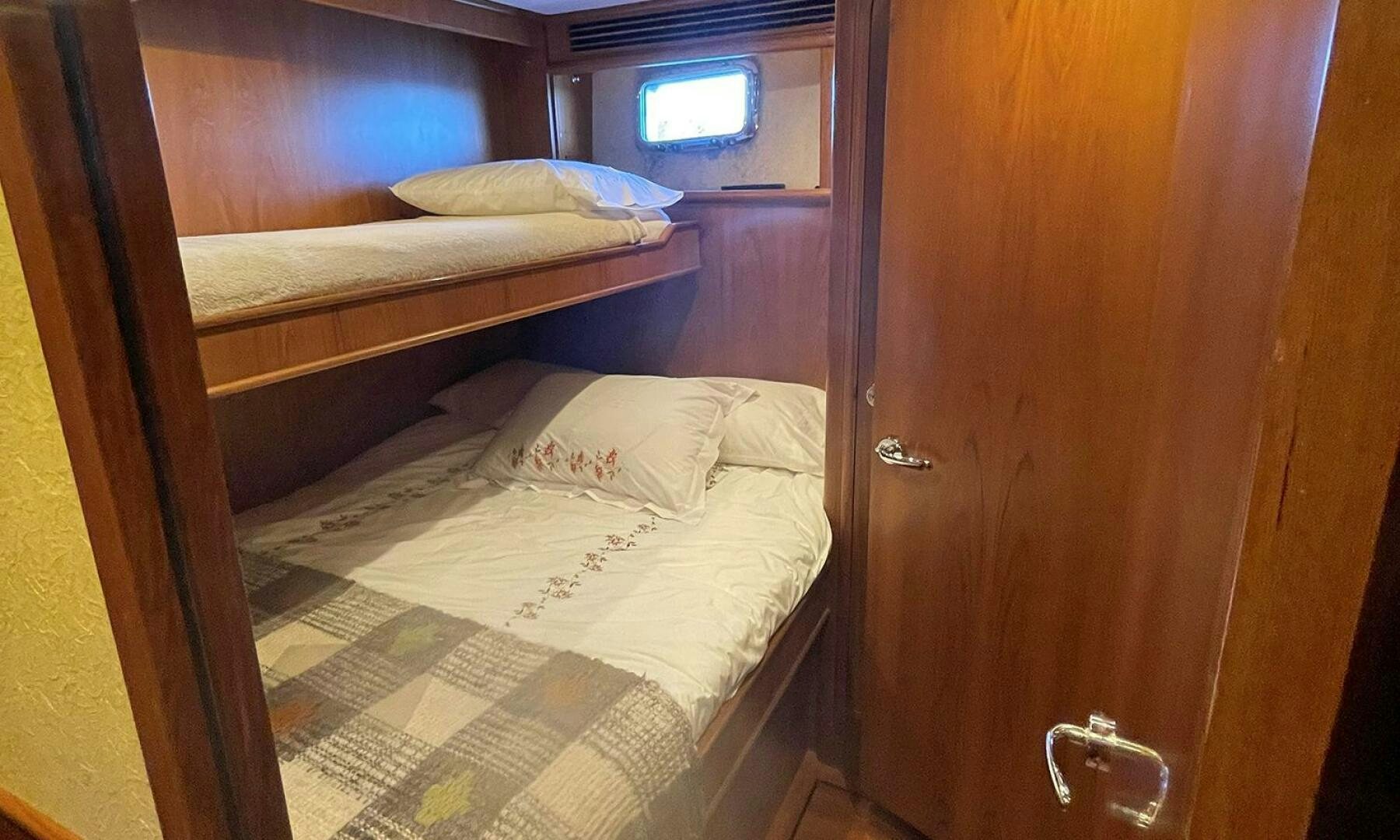 a room with two beds aboard BRAVO! Yacht for Sale