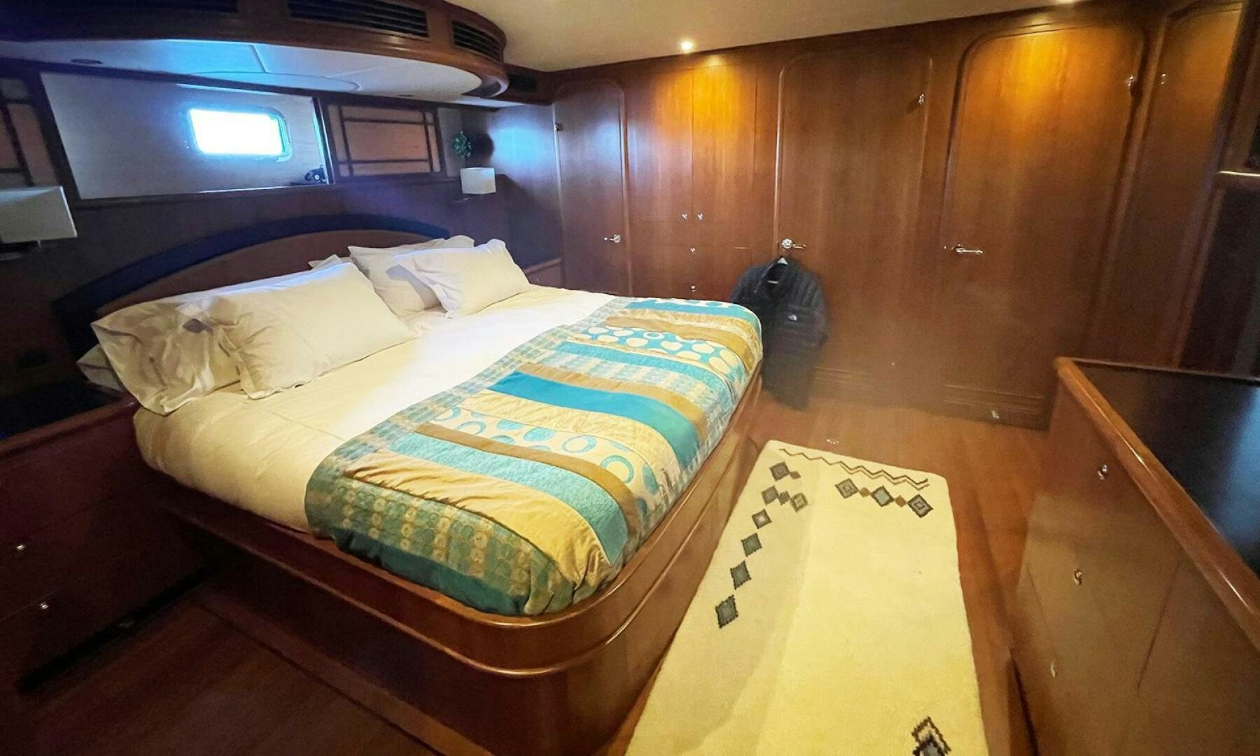 a bed in a room aboard BRAVO! Yacht for Sale