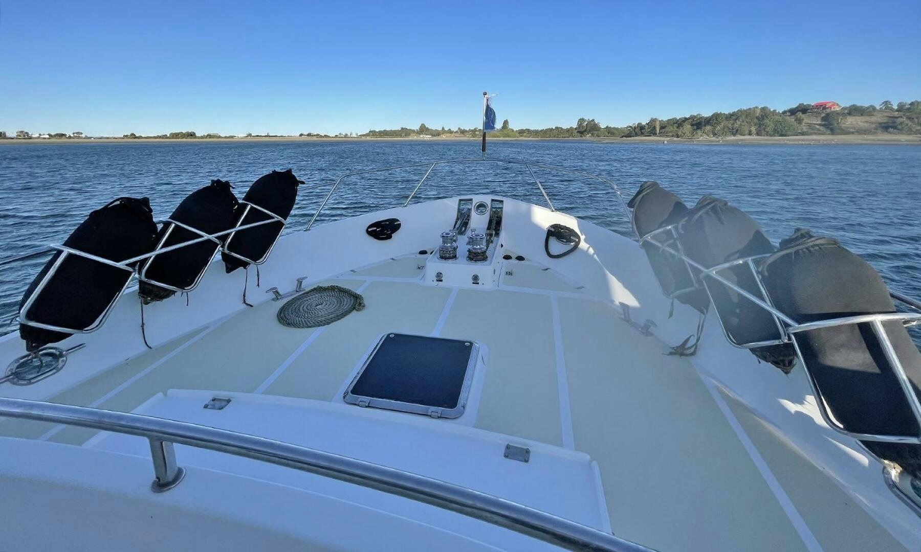 a boat with a black top and a white boat on the water aboard BRAVO! Yacht for Sale