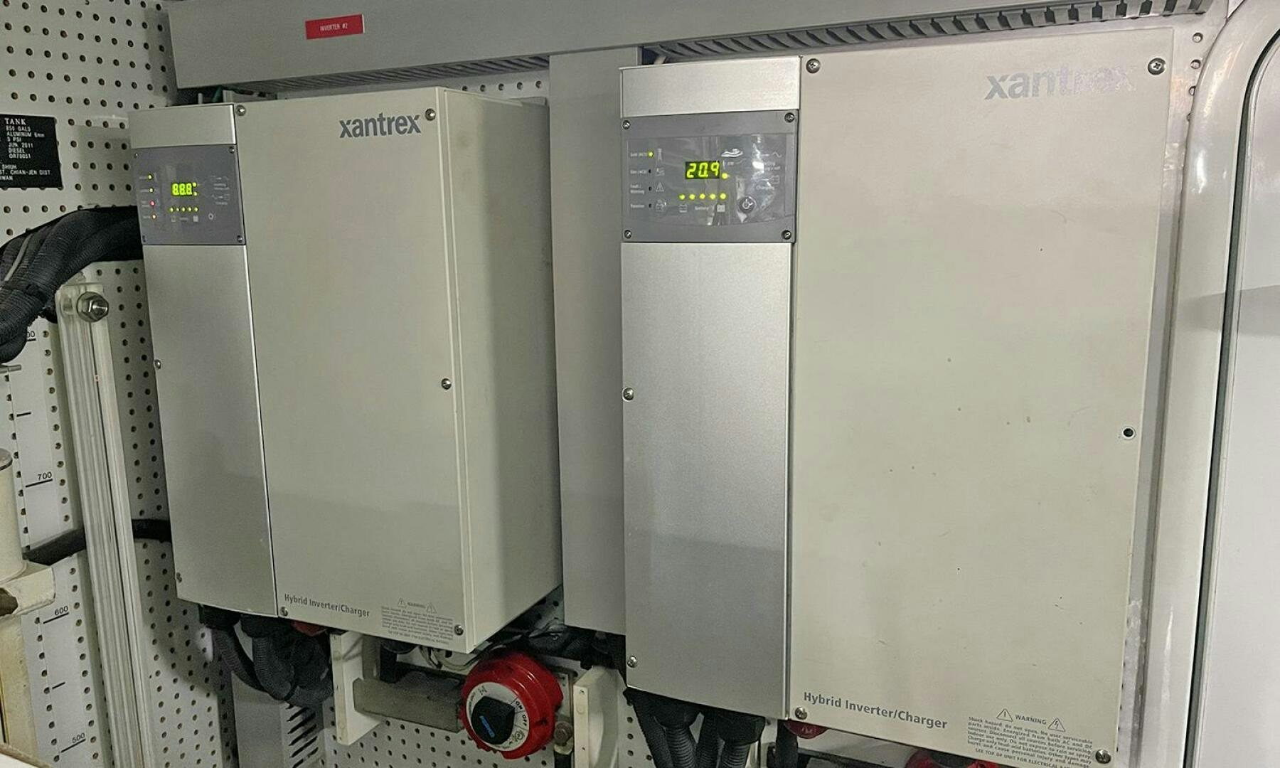 a white machine with a red and black label aboard BRAVO! Yacht for Sale