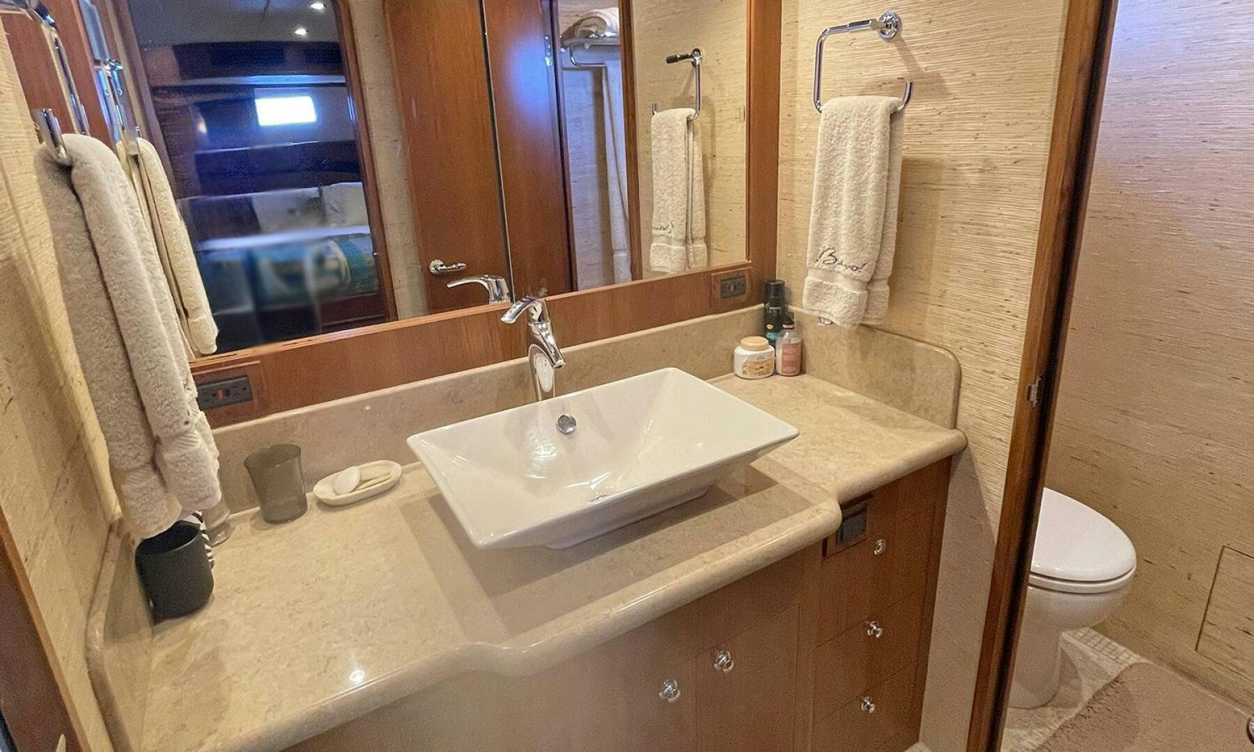 a bathroom with a sink and a mirror aboard BRAVO! Yacht for Sale