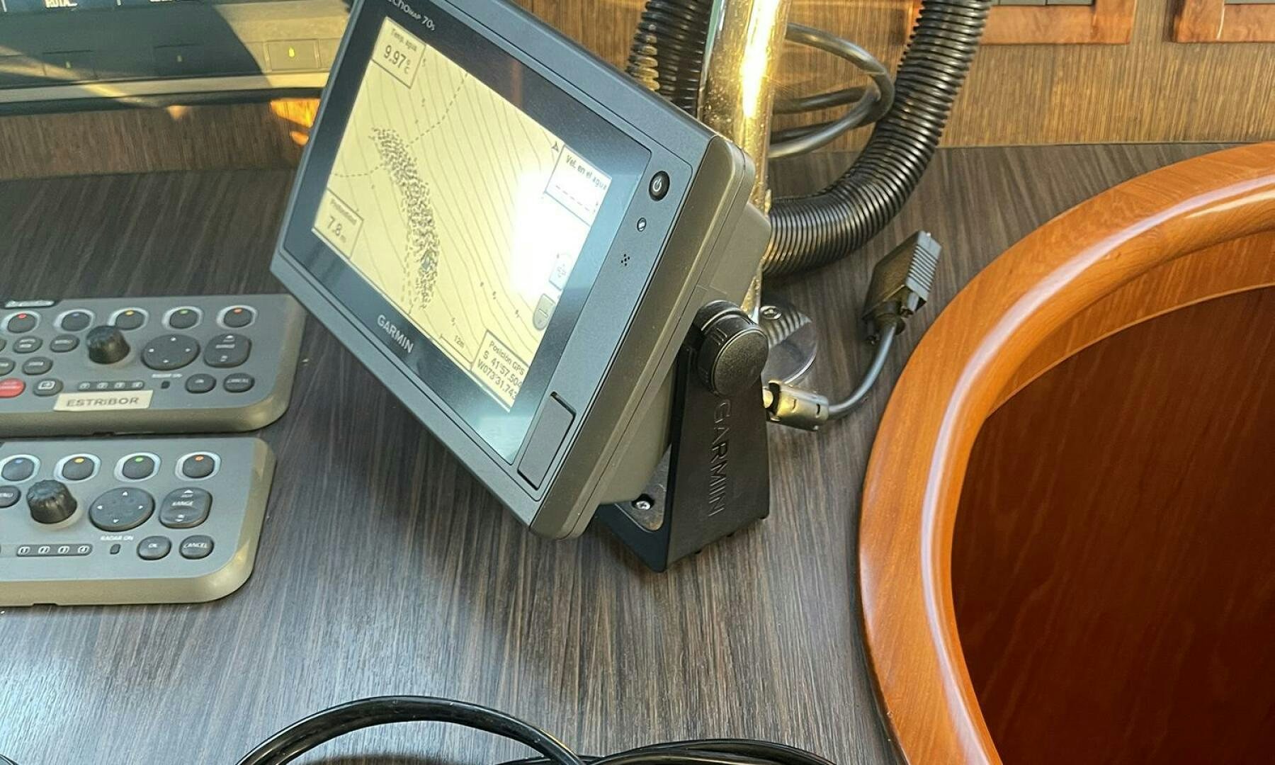 a handheld game console and a remote aboard BRAVO! Yacht for Sale