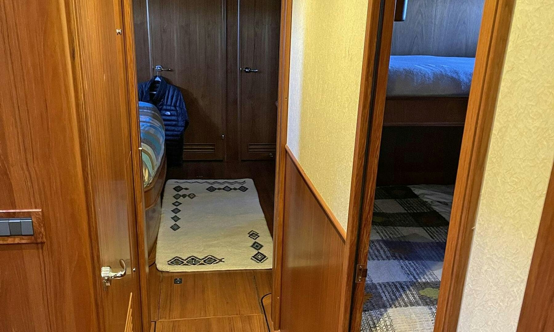 a room with a door open aboard BRAVO! Yacht for Sale