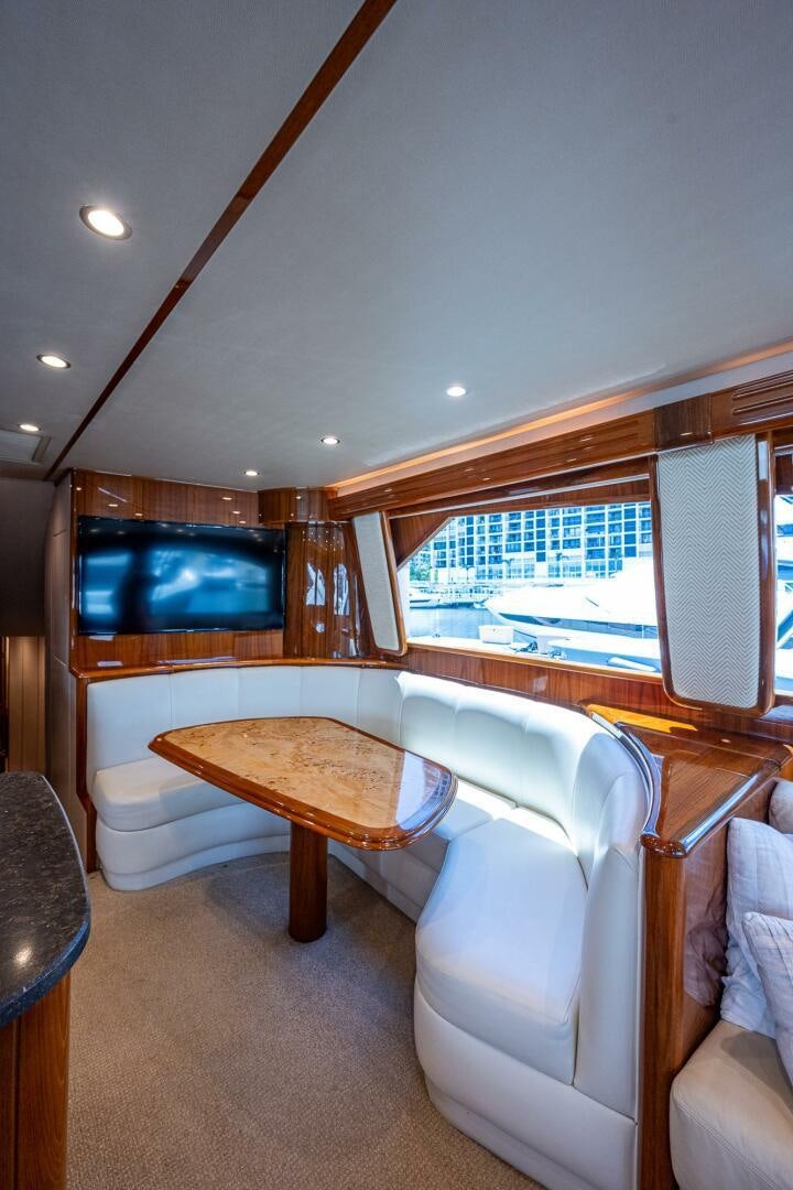 a room with a table and chairs aboard GYPSEA Yacht for Sale