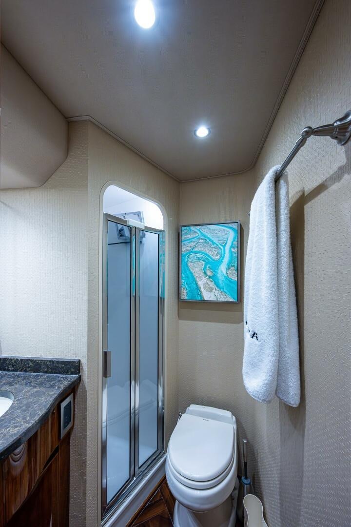 a bathroom with a shower and toilet aboard GYPSEA Yacht for Sale