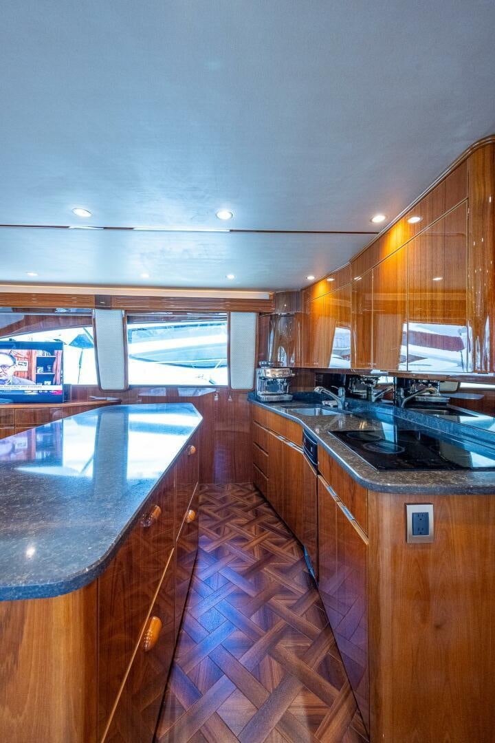 a kitchen with a large island aboard GYPSEA Yacht for Sale