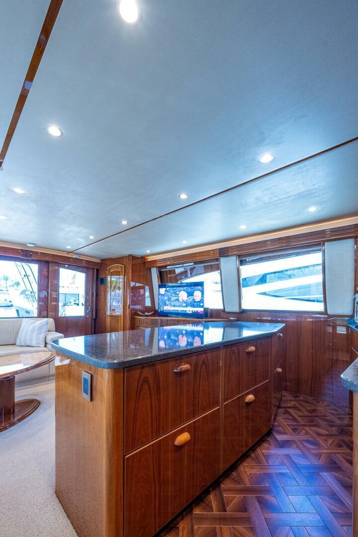 a kitchen with wooden cabinets aboard GYPSEA Yacht for Sale