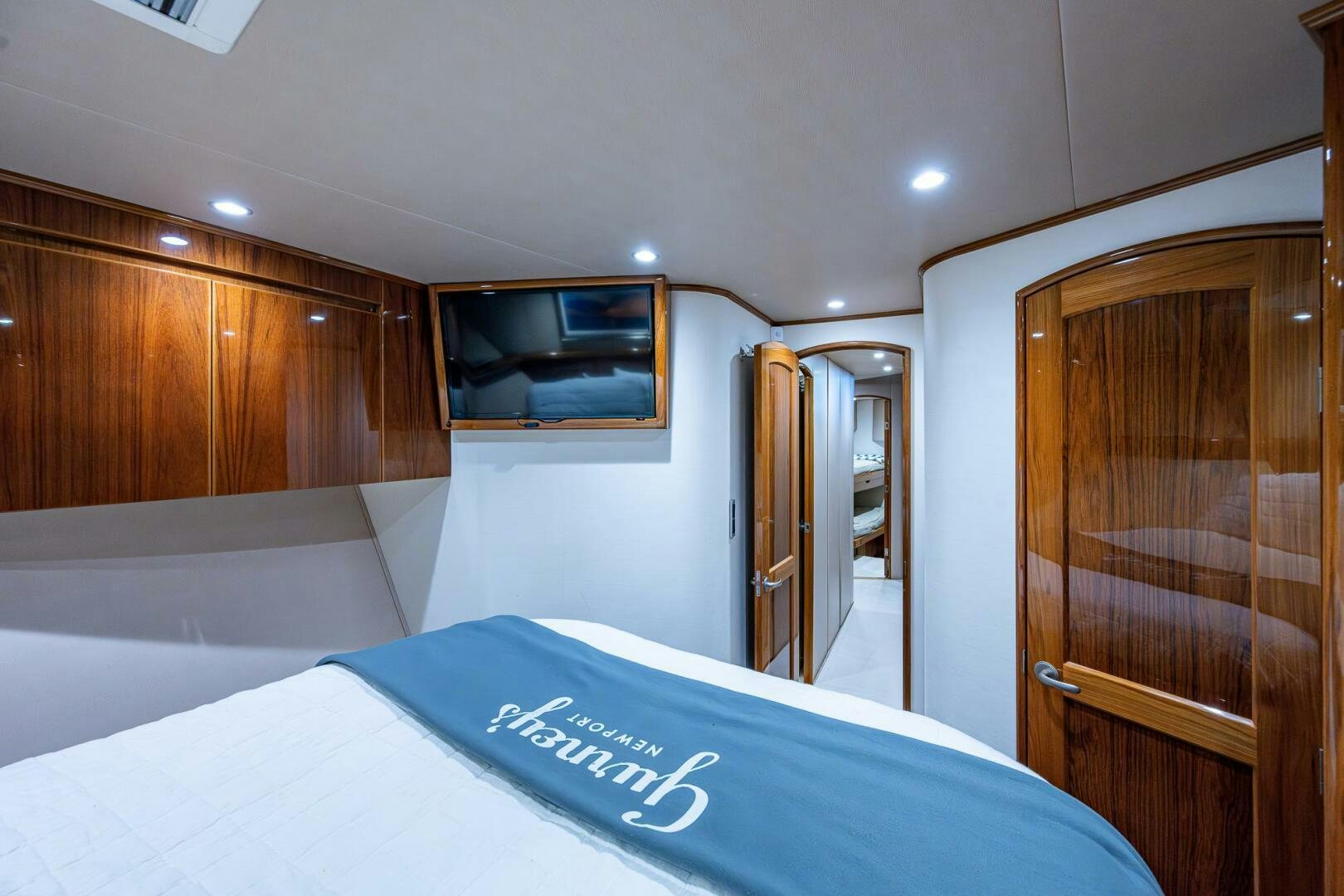a hotel room with a bed and a television aboard GYPSEA Yacht for Sale