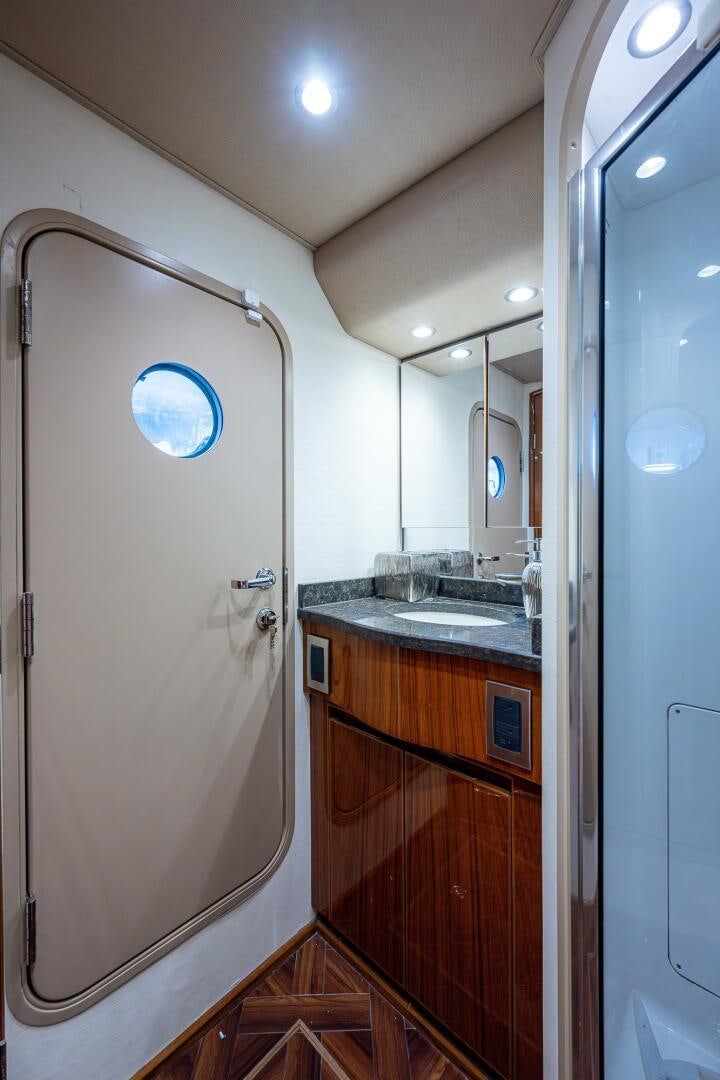 a bathroom with a sink and a mirror aboard GYPSEA Yacht for Sale