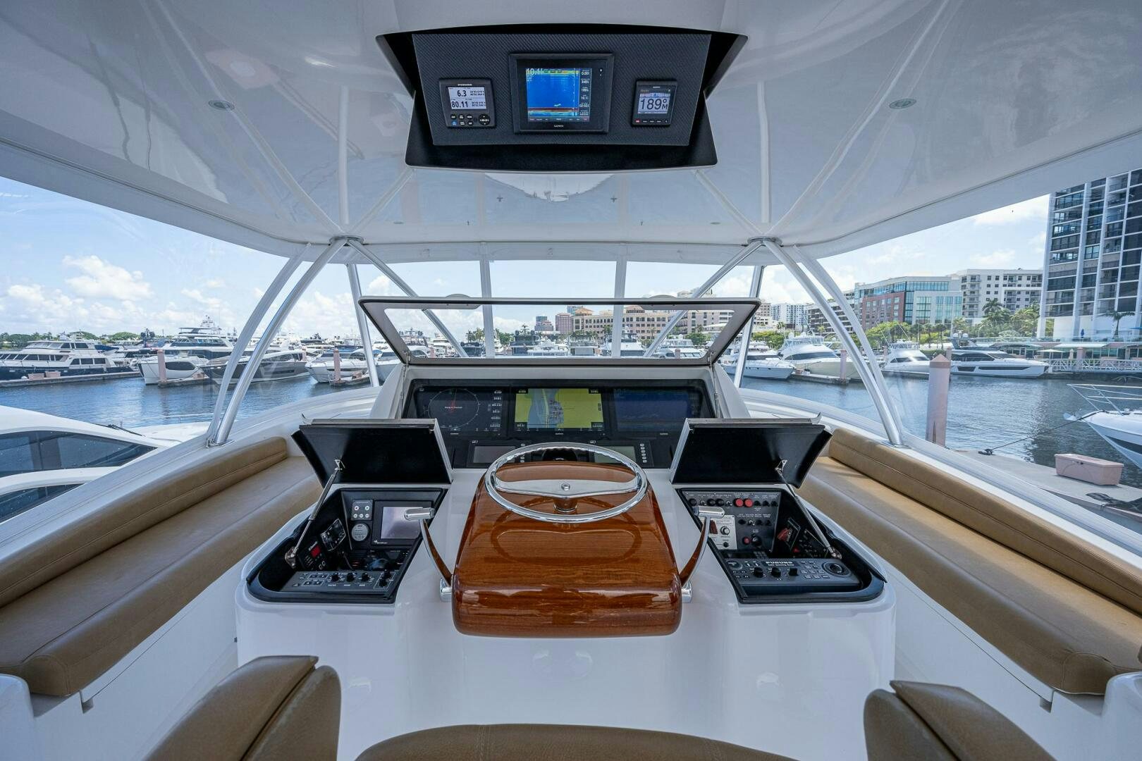 a boat with a screen and a table with chairs on it aboard GYPSEA Yacht for Sale